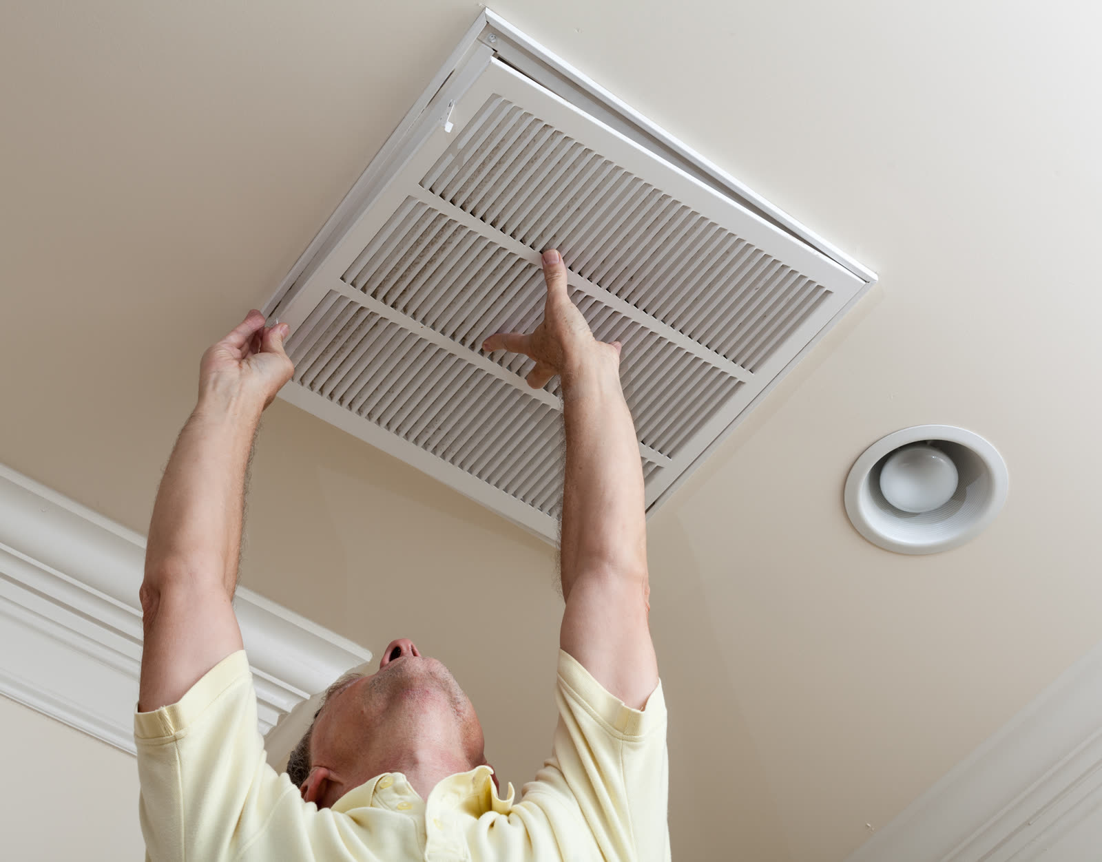 Ceiling register being opened during a zoning install